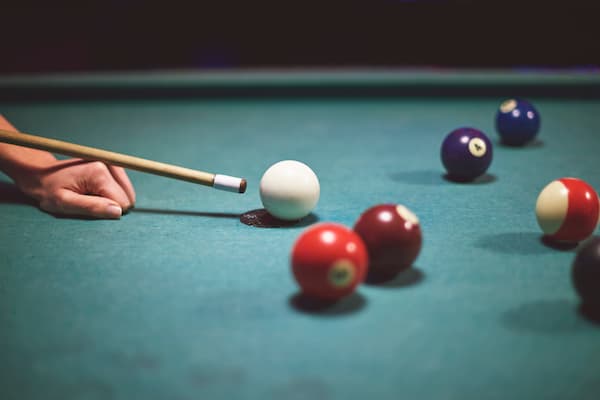 close-up-on-hand-aiming-to-play-pool-game